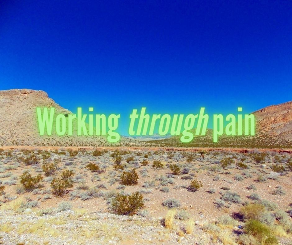 Photo of a desert landscape with the text 'Working through pain'